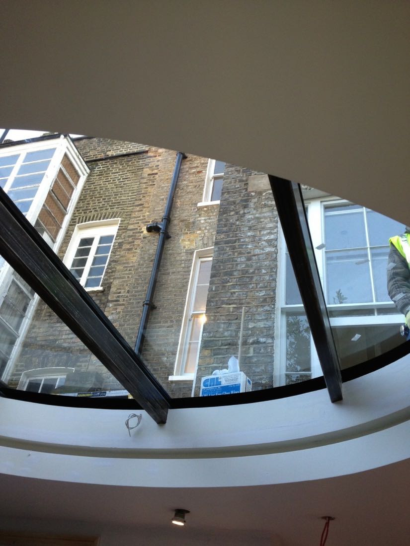 working on unusual glass rooflight