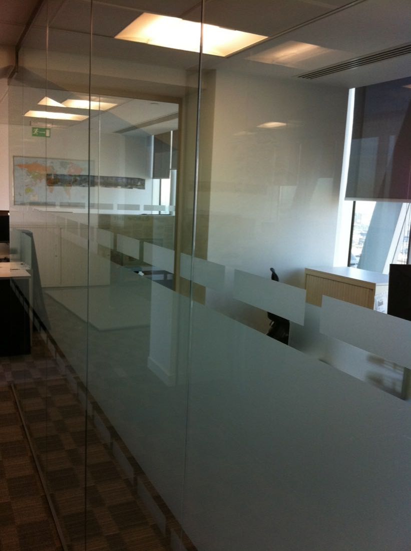 Office partitions scratched by desks and cupboards